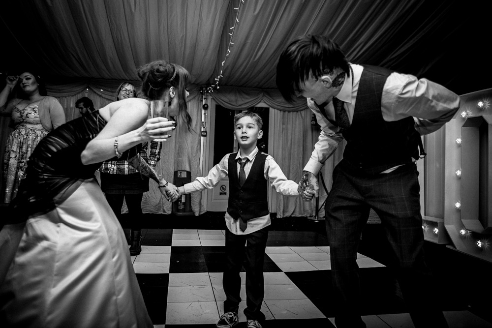 Wedding photography by Fez Photography — a figure in a room, black and white