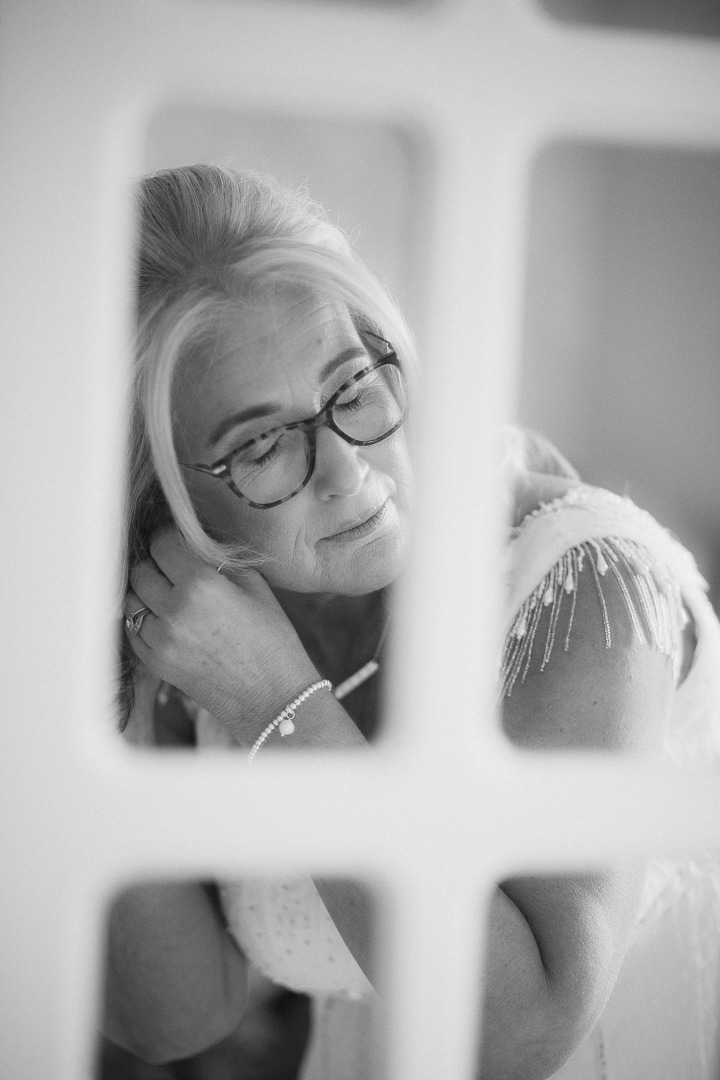 Wedding photography by Fez Photography — a figure framed against bright light, black and white
